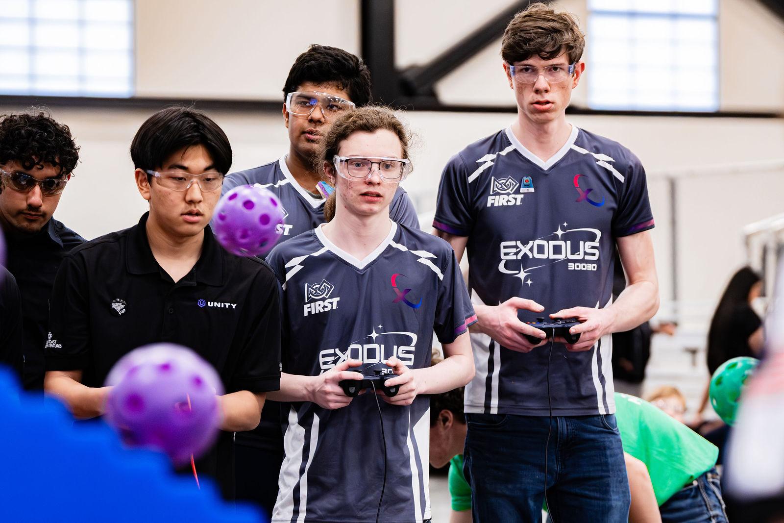 A FIRST Tech Challenge drive team at the driver station during a match